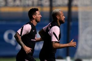 PSG's Lionel Messi, left, and Neymar train at the Paris Saint-Germain training camp in Saint-Germain-en-Laye, west of Paris, Friday, Aug. 13, 2021 The 34-year-old Argentina star arrived Tuesday in Paris to sign a two-year deal with the option for a third season with PSG after leaving Barcelona. (AP Photo/Francois Mori)