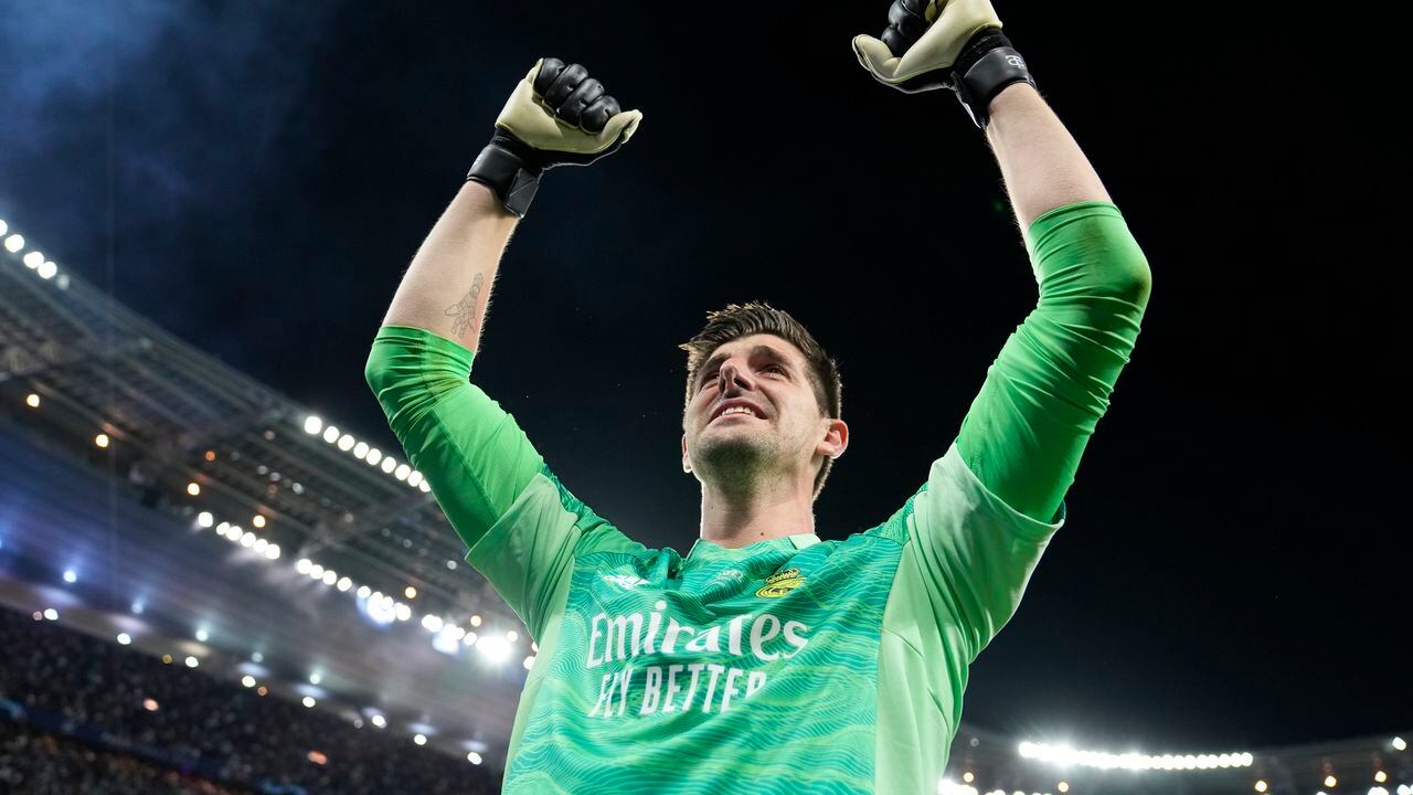 Real Madrid's goalkeeper Thibaut Courtois celebrates after winning the Champions League final soccer match between Liverpool and Real Madrid at the Stade de France in Saint Denis near Paris, Saturday, May 28, 2022. (AP Photo/Frank Augstein)