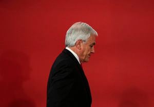 FILE - Chilean President Sebastian Pinera leaves at the end of a ceremony where he introduced his reshuffled Cabinet at La Moneda presidential palace in Santiago, Chile, Oct. 28, 2019. Piñera died on Tuesday, Feb. 6, 2024 in a helicopter crash in Lago Ranco, Chile, according to Chilean Interior Minister Carolina Tohá who announced it on live TV. (AP Photo/Esteban Felix, File)