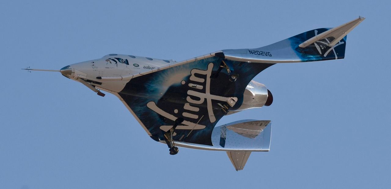 (FILES) In this file photo taken on December 13, 2018 Virgin Galactic's VSS Unity comes in for a landing after its suborbital test flight in Mojave, California. - After flying its founder Richard Branson to space, Virgin Galactic is restarting ticket sales beginning at $450,000, the company announced August 5, 2021. (Photo by Gene Blevins / AFP)