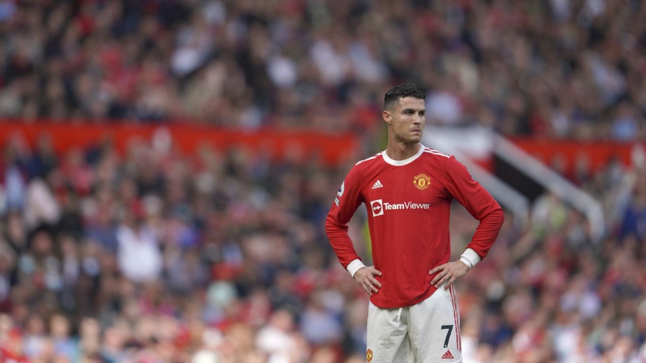 Manchester United's Cristiano Ronaldo stands on the pitch during the English Premier League soccer match between Manchester United and Norwich City at Old Trafford stadium in Manchester, England, Saturday, April 16, 2022. (AP/Jon Super)