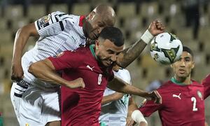 Ghana's captain Andre Ayew, top left, collides with Morocco's captain Romain Saiss during the African Cup of Nations 2022 group B soccer match between Morocco and Ghana at the Ahmadou Ahidjo stadium in Yaounde, Cameroon, Monday, Jan. 10, 2022. (AP Photo/Themba Hadebe)